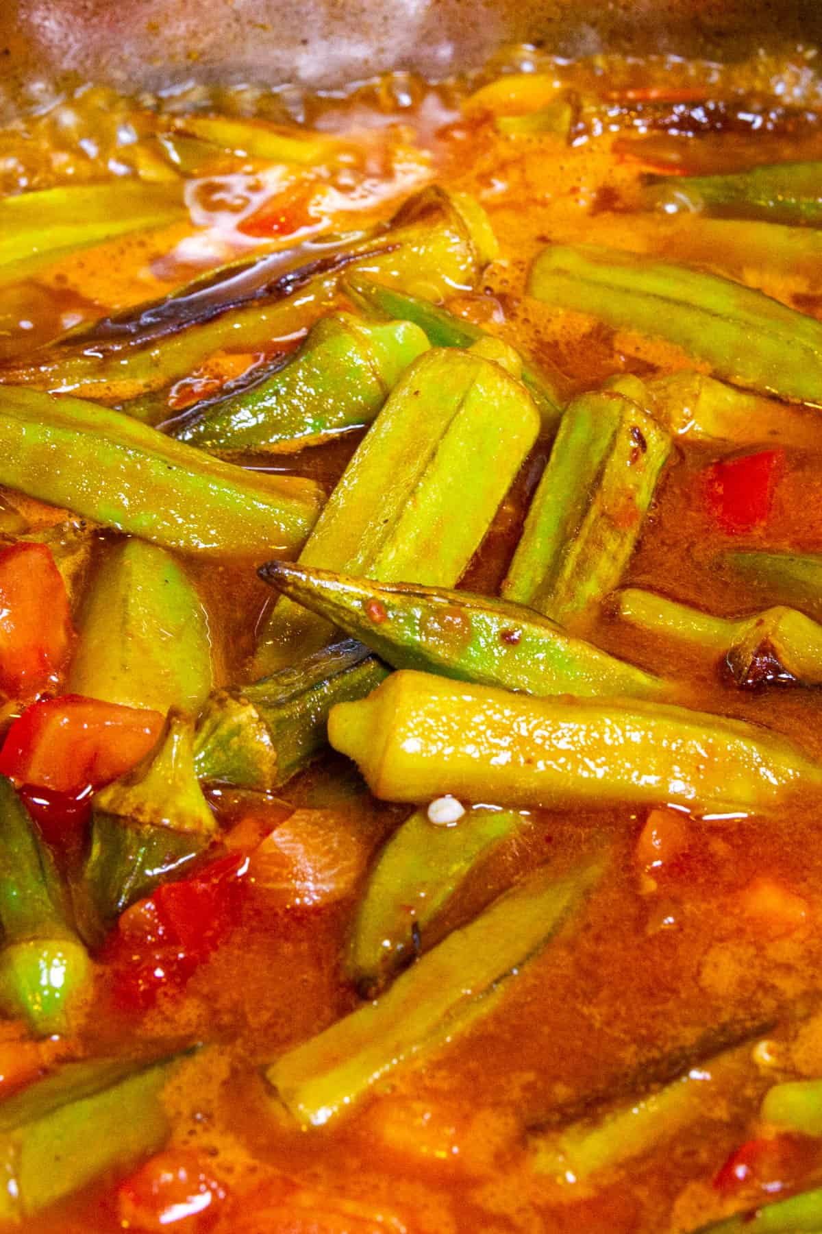 A close up shot of the stewed okra.