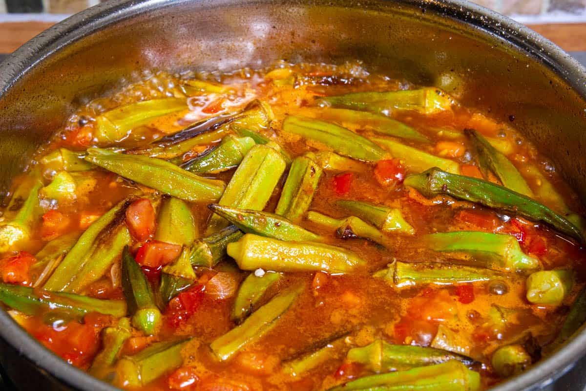 Adding the rest of the ingredients to the frozen okra.