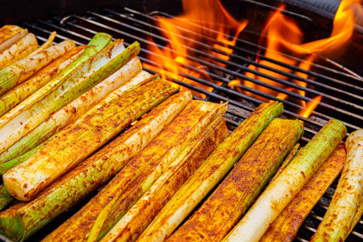 Adding the leeks to the smoker.