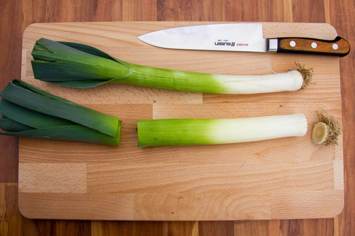 Separating the leeks into two parts.