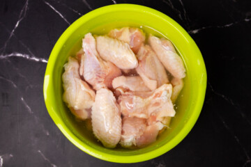 The chicken wings in the brine.