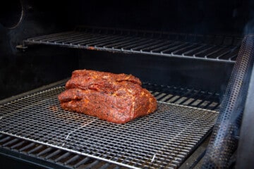 The raw chuck roast on the Traeger.