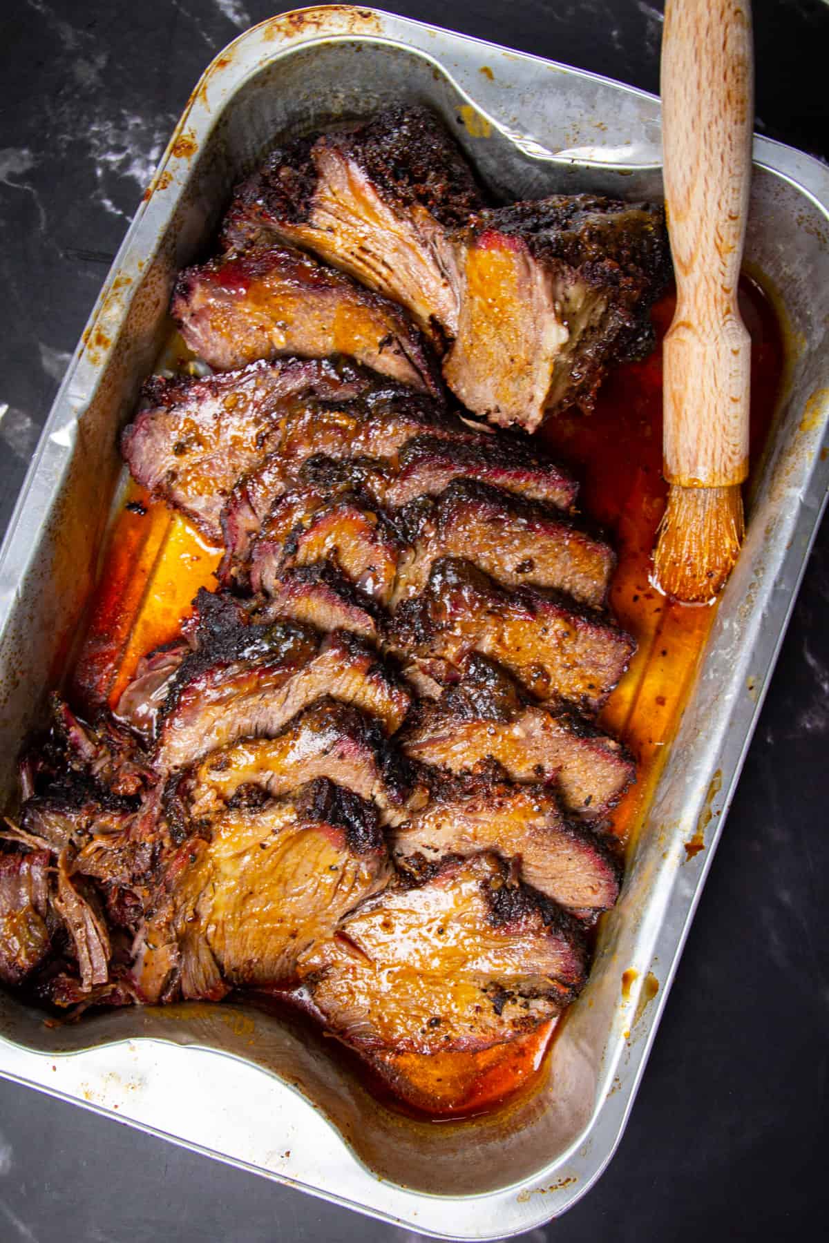 The finished chuck roast in tray all sliced up.