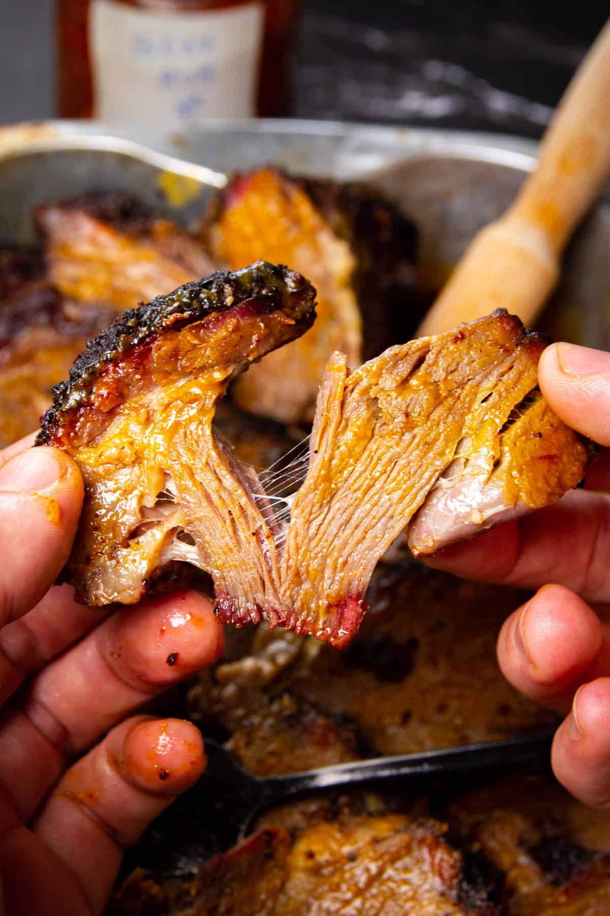 Pulling apart a tender piece of the chuck roast.