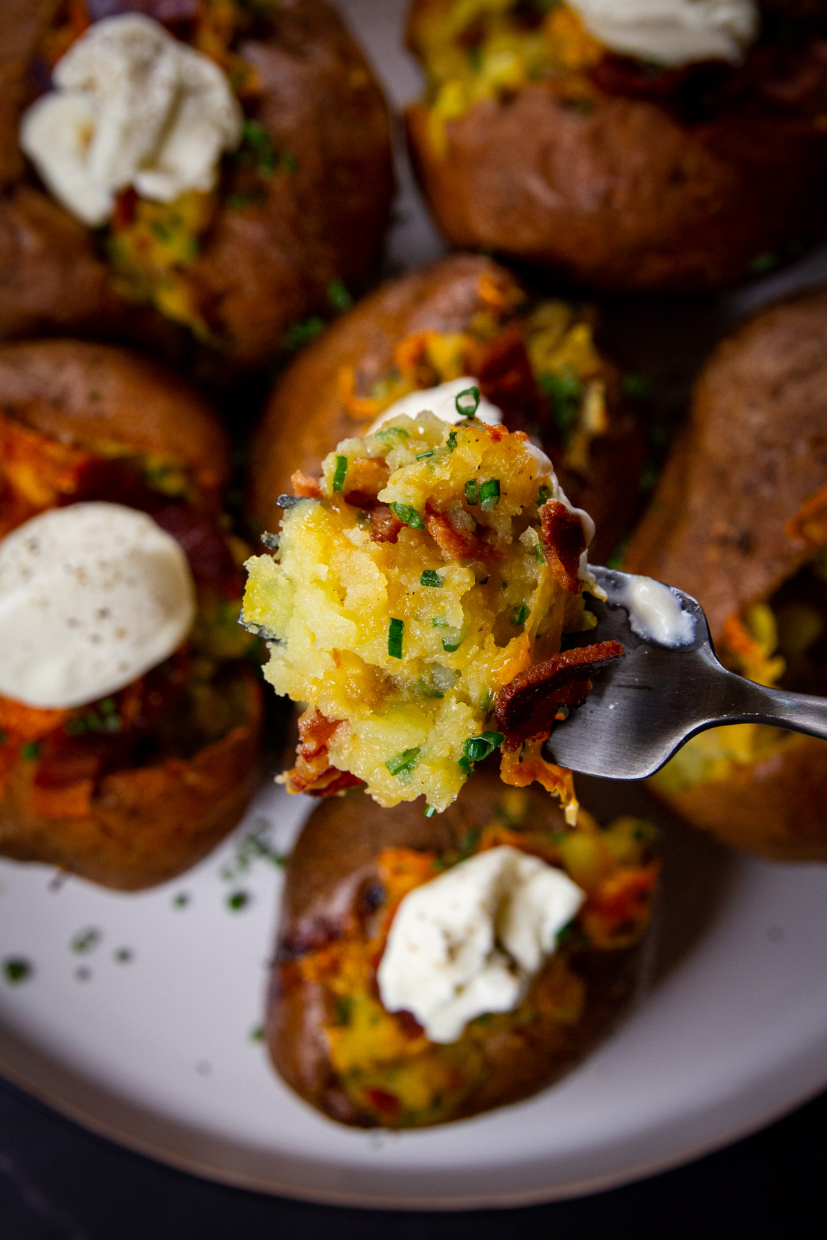 A close up of the twice baked smoked potato filling on a fork.