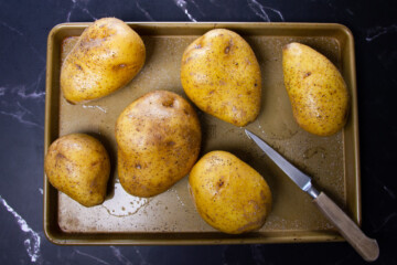 Poking holes in the potatoes with a small knife.