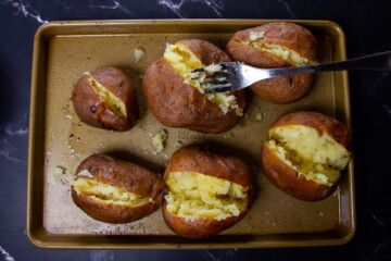 Fluffing the potatoes.
