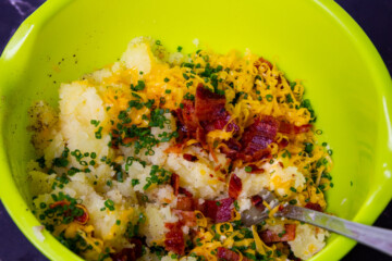 Mixing the inside of the potatoes.