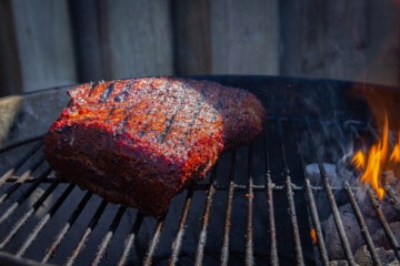 Searing the tri tip over the charcoal grill.