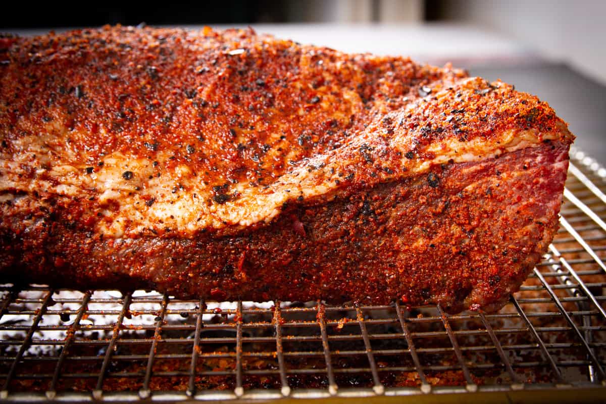 The cured, smoked tri tip on a resting rack.