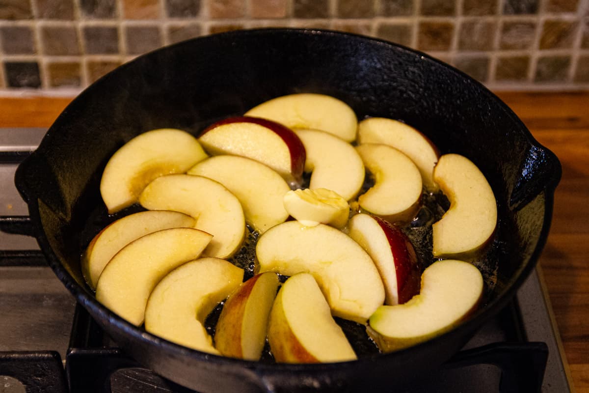 Frying the apples in the butter.